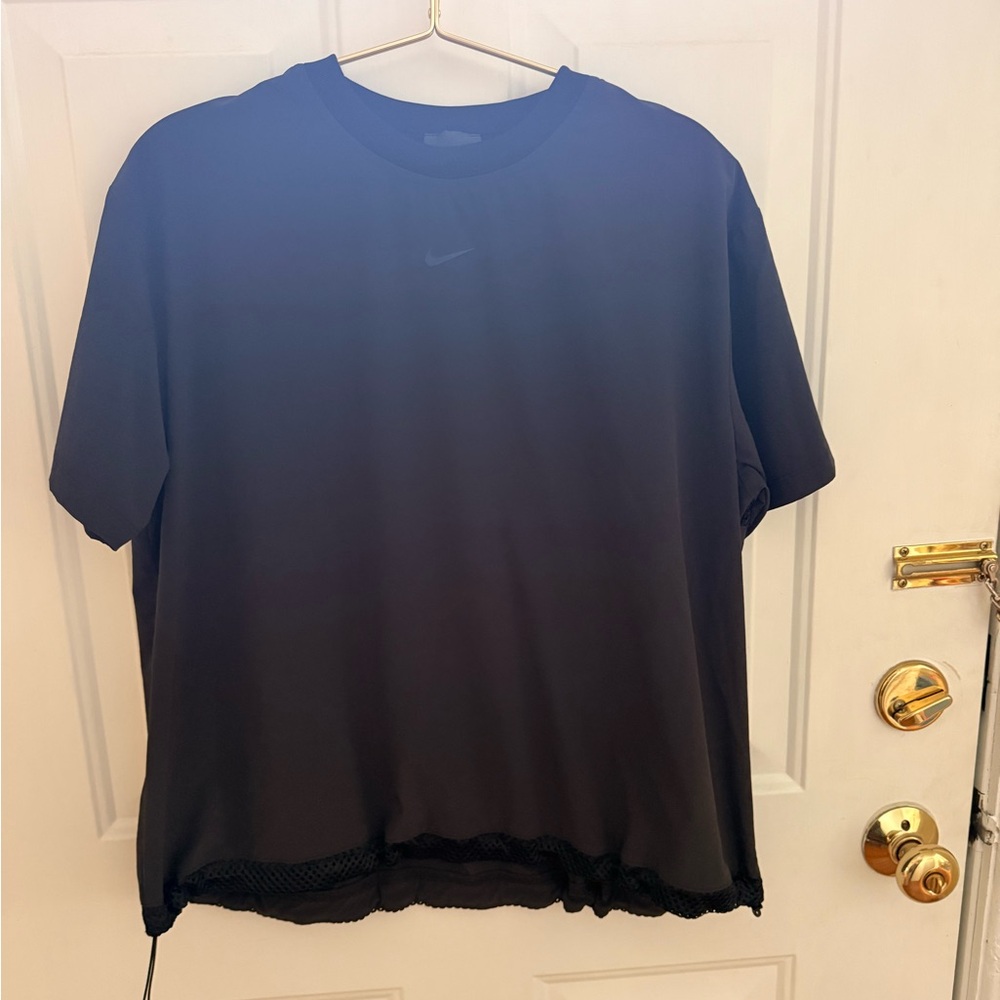 Nike Women’s Small Top, Short sleeves, adjustable waste, half mesh back.